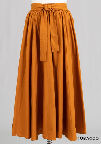 Made of 100% cotton, these skirts' eye-catching designs come in a multitude of colors. Stylishly belted at the waist, they possess a graceful ankle-length fit that makes a bold fashion statement at any event.
