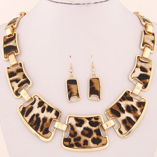 This gold linked cheetah print necklace and earring set is a neutral-hued item that can create a stunning focal point for any black, white, cream, or tan outfit.