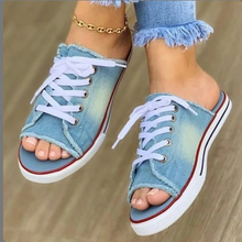 Load image into Gallery viewer, Experience the stylish comfort of our denim canvas flat slipper, perfect for the spring and summer seasons. This women&#39;s slipper features a lace-up design and a trendy peep toe for a chic and casual look.
