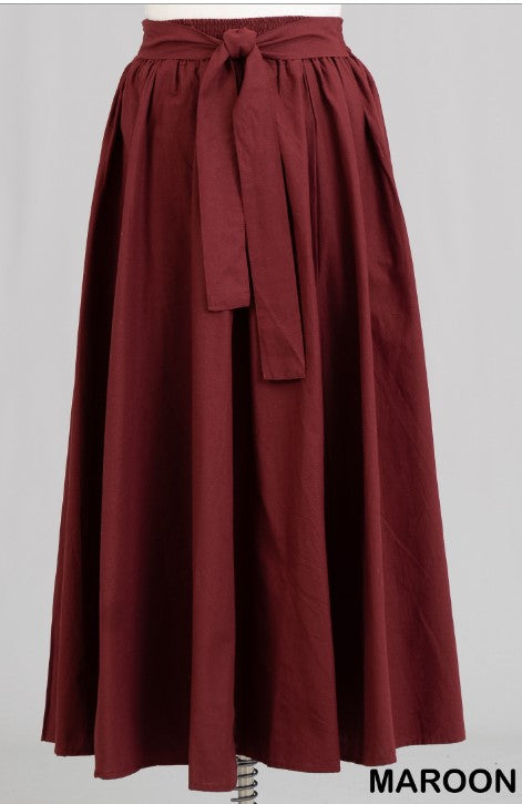 Made of 100% cotton, these skirts' eye-catching designs come in a multitude of colors. Stylishly belted at the waist, they possess a graceful ankle-length fit that makes a bold fashion statement at any event.
